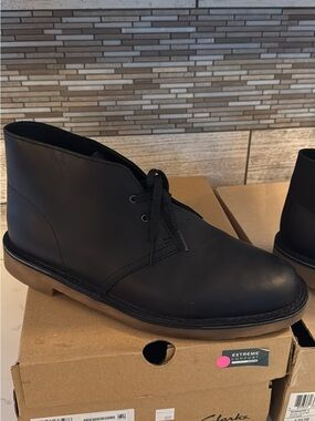 Clarks Men’s Black Leather Chukka Boots with Tan Crepe Sole